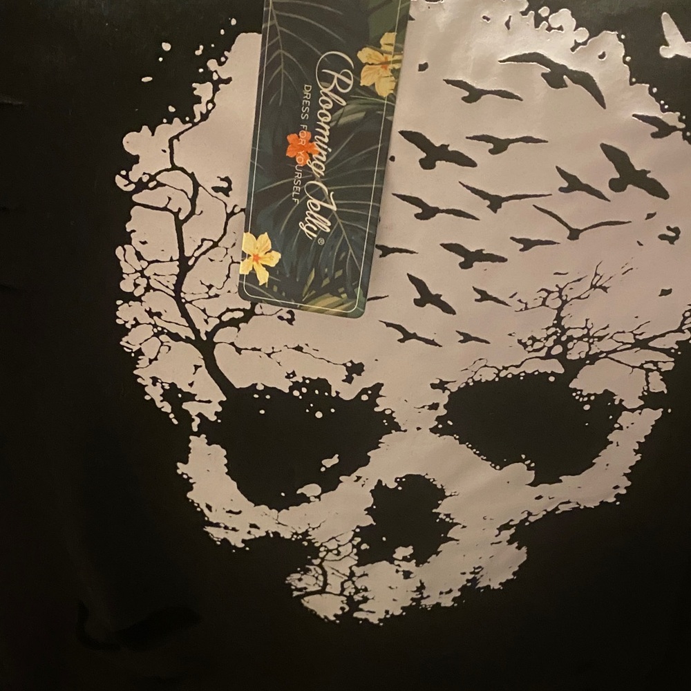 Black distressed skull hoodie.